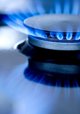 Close-up of blue flames from a gas burner