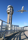 Photo of a jet taking off near the Montréal-Trudeau Airport control tower